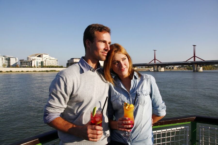 Budapest: 1 hr Sunshine Booze Cruise with Prosecco - The National Theatre and the southern turn