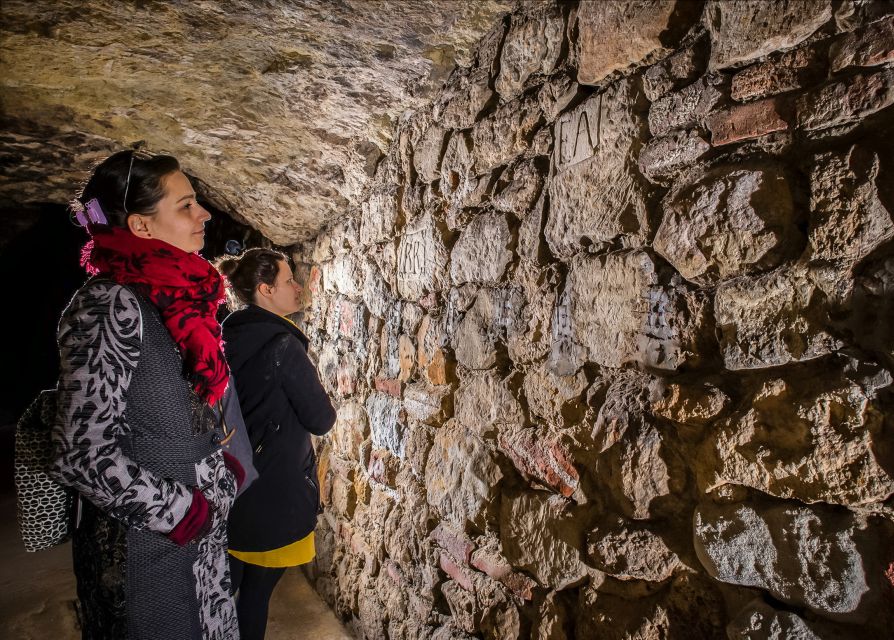 Budapest: Buda Castle Cave Tour - Natural limestone beside 800-year-old cellars