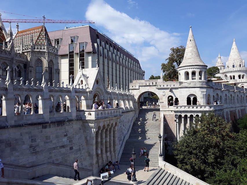 Budapest: Buda Castle Walking Tour & Folk Music Performance - Starting beneath the Holy Trinity Statue
