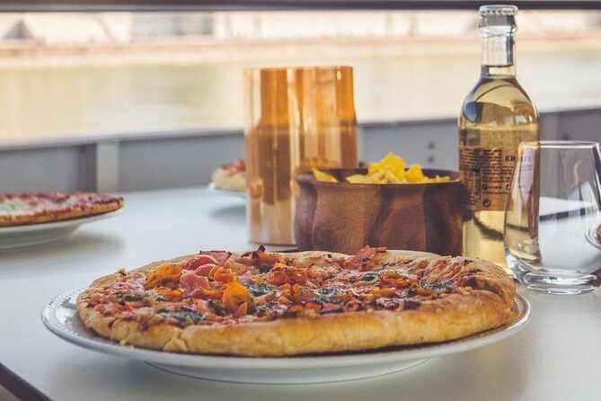 Budapest Danube Pizza Cruise with Welcome Drink - The university, Petőfi Bridge, and the National Theatre