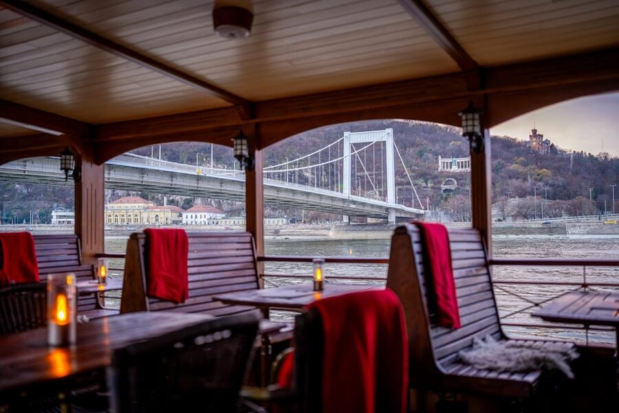 Budapest: Historic Cruise with Welcome Drink - Indoor warmth, outdoor views, and seating