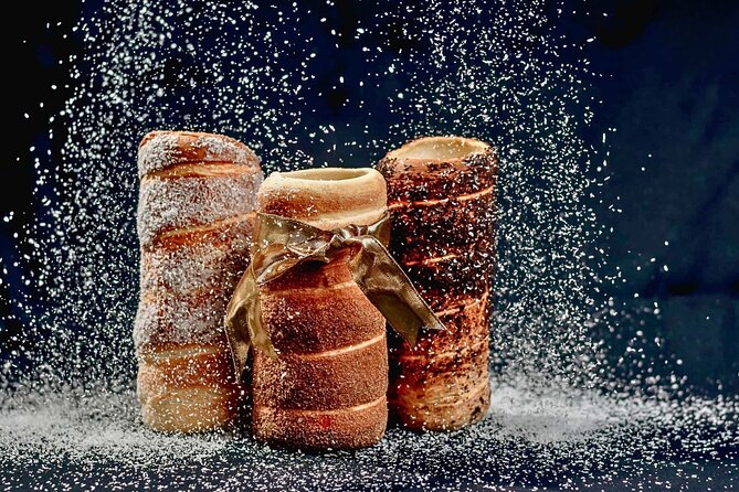 Kürtőskalács: Chimney Cake Workshop in City Park Budapest - Shaping three small chimney cakes